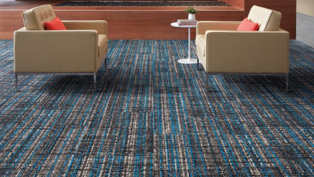 Interface Upload carpet tile and Textured Stones LVT in lobby area with couches